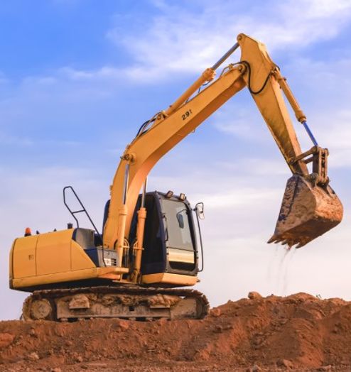 excavator grading a site